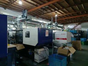 Factory machine for hand blender and immersion blender component assembly.